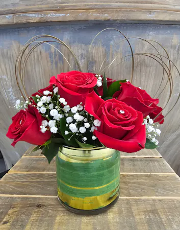 Red rose bouquet in quantity of 6 or 9 stems with diamante pins for shine. 