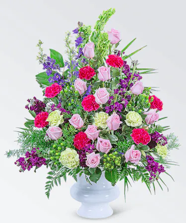 Our Always Remembered Urn is a gorgeous design with bright pinks, purples, and greens