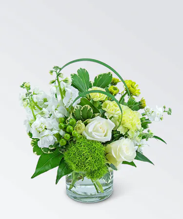 Cashmere Darling features roses, carnations, mums, green ball dianthus, hypericum berries, and a variety of foliage.