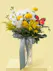 A light up acrylic vase decorated with daisies filled with stock, white daisies, yellow buttons 