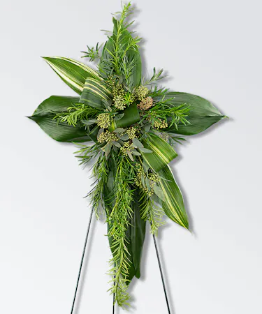 Sympathy cross of all greenery on standing easel