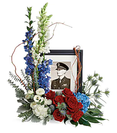 Patriotic flowers surrounding photo frame