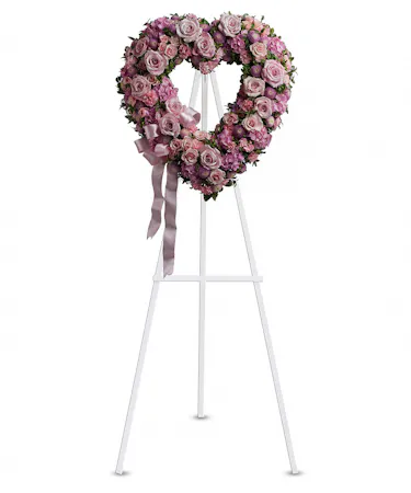 Open heart wreath in pinks and lavenders on an easel