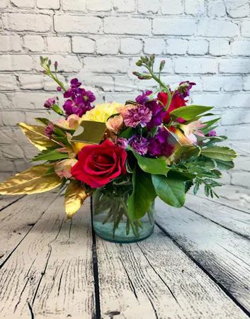a romantic lush bouquet in purples, lavenders and pinks which also includes 2 handmade truffles in gold boxes