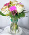 This fun arrangement arrives with glittered roses, carnations and daisies in a cute vase which we accent with a set of Soul Stacks Bracelets