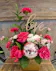 Pink roses, carnations and mini carnations in a gold cube with pink "disco" balls and a gold "Love" sign