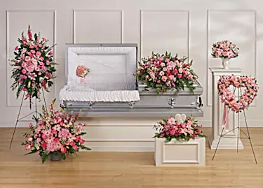 All pink Funeral tribute Display featuring casket piece, Standing easel,  heart wreath, casket insert, basket and heart stone tribute