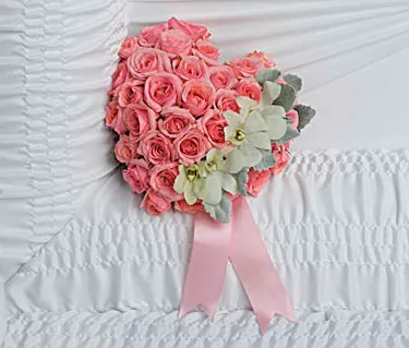 Heart shaped casket lid insert of pink roses