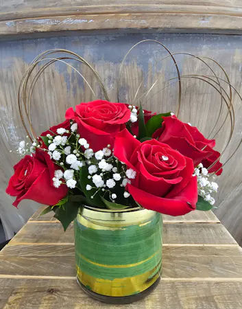 Red rose bouquet in quantity of 6 or 9 stems with diamante pins for shine. 