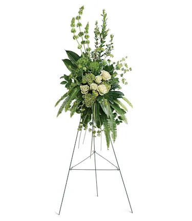 Standing easel modern style arrangement of green & white flowers with tropical greenery